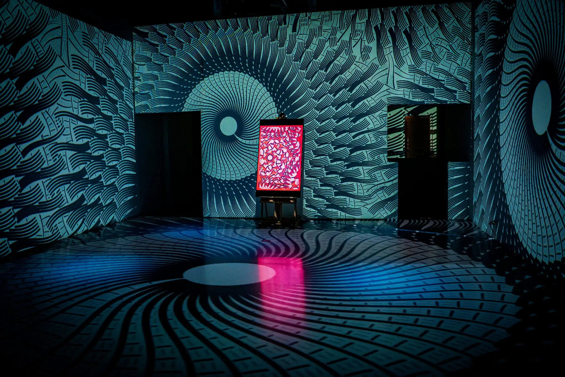 An INTRICADA screen in a room of spiral projections, Lume Studios, New York.
