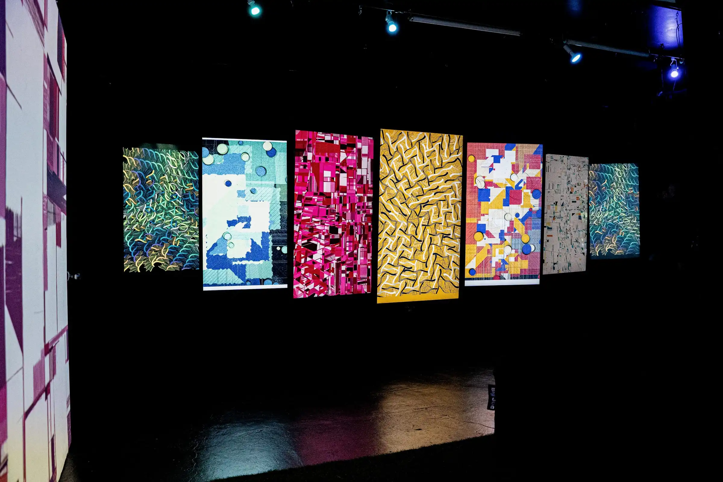 A wall of screens showing works by Camille Roux and other Bright Moments artists, Lume Studios, New York.